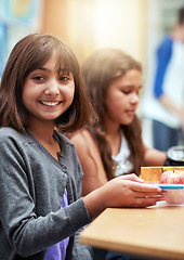 Image showing Girl, happy and portrait with lunch at school for recess, break or nutrition at table with meal. Kid, face and smile at academy or relax with confidence, food or pride for childhood development