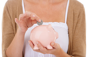 Image showing Woman, hands and coin in piggy bank for savings, investment or financial growth on a white studio background. Closeup of female person with money container for finance, budget or safe cash and profit