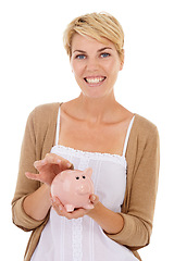 Image showing Happy woman, portrait and coin in piggy bank for savings, investment or financial growth on a white studio background. Female person smile with money container for finance, budget or cash to profit