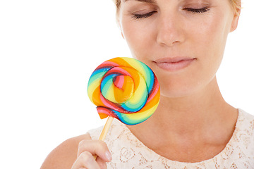 Image showing Woman, lollipop and studio or candy sweets snack on white background for treat, dessert or party food. Female person, eyes closed and model for fun cane taste or happy, colorful swirl or unhealthy