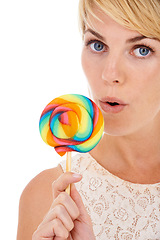 Image showing Woman, portrait and lollipop in studio or candy snack on white background as sweet treat, dessert or party food. Female person, face and model for fun cane taste or happy, colorful swirl or unhealthy