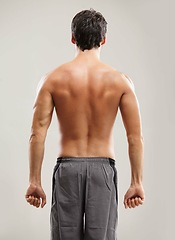 Image showing Back, topless or athlete for fitness results, wellness and health isolated on grey background in studio. Muscle, sports man or model with progress in exercise, workout and training on backdrop alone