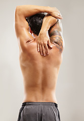Image showing Back, topless or man stretching arms for fitness, body workout or flexibility isolated on grey background. Healthy male model, spine or sports athlete in exercise, warm up or training in studio