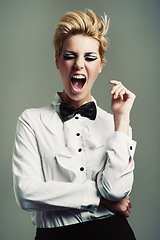 Image showing Portrait, bow tie or crazy woman with fashion, vintage clothes and classy aesthetic on grey background. Screaming, edgy fashionable model or cool girl with retro style and makeup isolated in studio