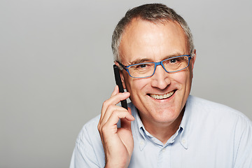 Image showing Phone call, portrait and senior businessman in a studio with pride for legal corporate career. Glasses, smile and professional elderly male lawyer on mobile discussion isolated by gray background.