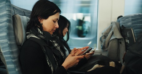 Image showing Women, reading and train by smartphone on social media and public transport on metro bullet in japan. Friends, cellphone or diversity on fast vehicle on weekend trip or commute in tokyo on adventure