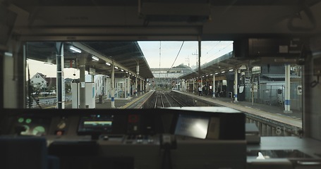 Image showing Train, window and travel with control panel, buttons or technology for transportation on track. Windscreen, machine and screen in locomotive by dashboard, railway infrastructure or journey in Tokyo