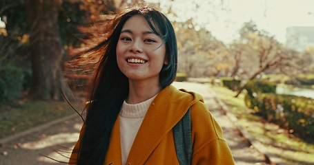 Image showing Japanese, portrait and woman with smile in park for travel on vacation, adventure and explore path with trees. Gen z, student and happy walk on holiday in nature, forest and trail in Kyoto woods