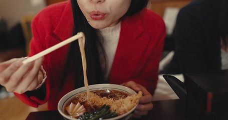 Image showing Woman, mouth and blowing ramen noodles in restaurant for dinner, diet and meal in cafeteria. Closeup, hungry lady and chopsticks for eating hot spaghetti, Japanese cuisine or lunch in fast food diner