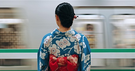 Image showing Woman, Japanese train station and kimono traditional dress for transport, journey or metro railway. Commute, motion blur and travelling on urban platform, locomotive in Tokyo and female person