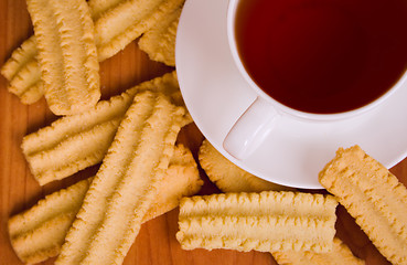 Image showing cup of black tea and cookies