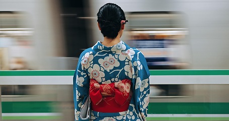 Image showing Japan woman, travel and train station in kimono and public transportation on metro bullet in city. Person, motion blur or traditional clothes by fast vehicle or subway in tokyo on urban adventure
