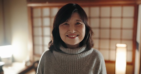 Image showing Smile, portrait and mature Japanese woman at her home with positive, good and confident attitude. Happy, proud and face of joyful female person with pride in modern house or apartment in Tokyo Japan.