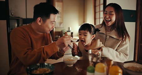 Image showing Family, eating and dinner with girl, parents and Japanese with joy, meal and home with happiness. Mother, apartment and father with kid, food and bonding together with nutrition, smile and love