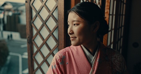 Image showing Japanese woman, window view and kimono for traditional style in home, ideas or remember by street. Girl, person or thinking with vision, happy memory or mindfulness in morning at apartment in Tokyo