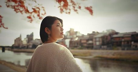 Image showing Woman, outdoor and thinking with ideas, summer and happy with wonder, daydreaming and nature. Japanese person, park and girl with decision, opportunity and wonder with thoughts, choice and spring