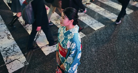 Image showing Woman, Japanese traditional clothes and walk in city, view and travel with journey outdoor. Fashion, adventure and urban street in Kyoto, kimono or dress for culture and style with local trip