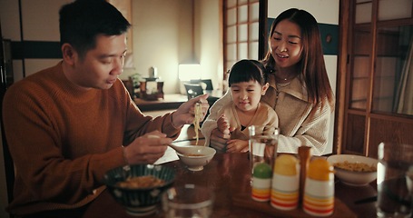 Image showing Family, food and dinner with girl, parents and Japanese with joy, meal and home with happiness. Mother, apartment and father with kid, noodles and bonding together with nutrition, smile and love