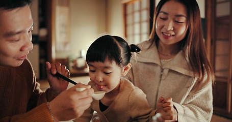 Image showing Family, eating and supper with girl, parents and Japanese with joy, meal and home with happiness. Mother, apartment and father with kid, feeding and bonding together with nutrition, smile and love