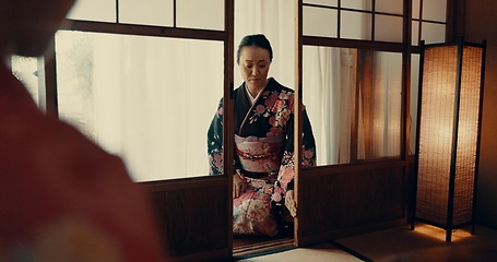 Image showing Woman, Japanese and tea ceremony for healing practice or respect for ritual, wellness or tatami room. Female person, kneel and warm drink for mindfulness zen in Tokyo for spiritual, health or calm