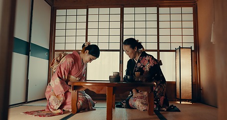 Image showing Traditional, home and Japanese women with tea for culture with leaves and herbs in tearoom. Friends, ceremony and people with herbal beverage for wellness, mindfulness and detox for drinking ritual