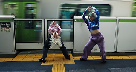 Image showing Asian woman, dancing and railway station by train for energy, art or underground performance in subway. Female person, friends or hip hop dancers in Japan, practice or training together by transport