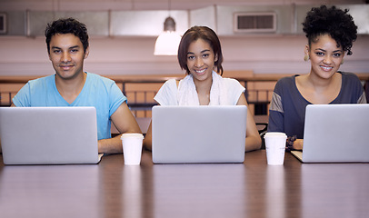 Image showing University, laptop and portrait of students in library for online research, studying and learning. Education, college and men and women on computer for internet, assignment and website for knowledge