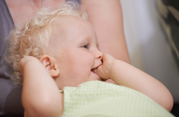 Image showing Children, baby and kid suck thumb in home, adorable or cute innocent child with parent in house. Young blonde toddler, finger or hand in mouth and facial expression of healthy little girl in comfort