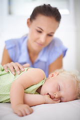 Image showing Sweet, sleeping and mother with baby on bed for bonding, relax and happy cute relationship. Love, smile and young mom watching girl child, kid or toddler taking a nap in bedroom or nursery at home.