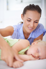 Image showing Love, sleeping and mother with baby on bed for bonding, relax and sweet cute relationship. Happy, smile and young mom watching girl child, kid or toddler taking a nap in bedroom or nursery at home.