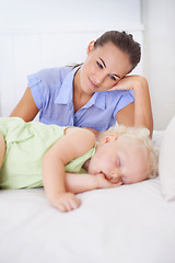 Image showing Love, sleeping and mother with baby on bed for bonding, relax and sweet cute relationship. Happy, smile and young mom watching girl child, kid or toddler taking a nap in bedroom or nursery at home.