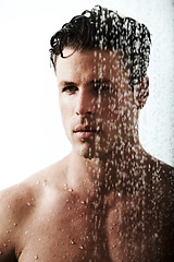 Image showing Man in bathroom shower, cleaning body and relax for morning wellness, hygiene and skin routine. Grooming, skincare and face of male model with muscle washing with water, self care and calm bathroom.