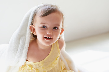 Image showing Baby, girl and blanket in portrait at home, child development and curious for childhood. Female person, healthy kid and sweet or comfort at house, peaceful and playing on floor or relaxing for growth