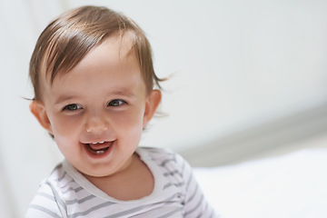 Image showing Baby, happy and playing on floor, child development and infant growth with face, sitting and home. Girl, joyful and healthy in good mood, childhood and cheerful with enthusiasm, kid and adorable