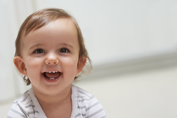 Image showing Baby, smiling and playing on floor, child development and infant growth with face, sitting and home. Girl, joyful and healthy in good mood, childhood and cheerful with enthusiasm, kid and adorable