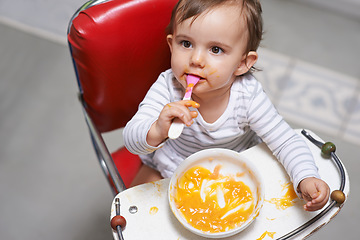 Image showing Baby, high chair and food, nutrition and health for childhood development and wellness. Healthy, growth and girl toddler at home, vegetable or fruit with hungry kid eating a meal and spoon in mouth
