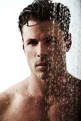 Image showing Serious portrait of man in shower to relax, cleaning hair and body for morning wellness, hygiene and routine. Grooming, skincare and face of male model with muscle in water splash, self care and calm
