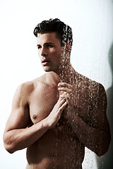 Image showing Man in shower with muscle, clean body and splash for morning wellness, hygiene and skin routine in home. Grooming, skincare and relax, male model washing in water with self care and calm bathroom.