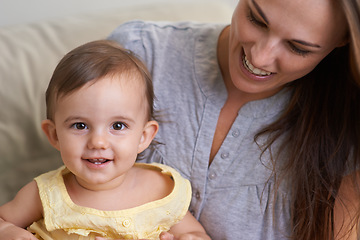 Image showing Mother, baby and portrait smile in relax of adorable and happy little girl sitting on mommy at home. Face of mama holding young newborn child, kid or toddler for parenting, bonding or love at house