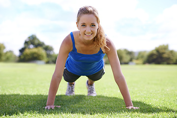 Image showing Women, face and push ups on grass for fitness with exercise, training and workout on sports field. Athlete, person and confidence on ground with physical activity for healthy body or wellness outdoor