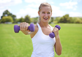 Image showing Woman, portrait and dumbbells, weightlifting for exercise and muscle, athlete outdoor for sport and bodybuilding. Healthy, fitness equipment and strong in park with bodybuilder and workout with smile