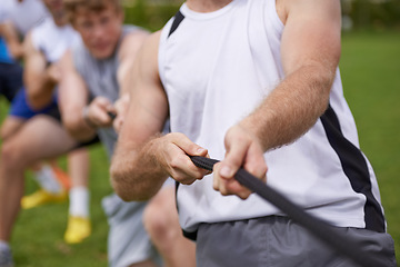 Image showing Rope, arm pull and men hands with teamwork, tug of war and fitness outdoor on sport field. Training, workout and athlete group with support together for competition and strong exercise for health