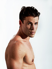 Image showing Shower, sexy and portrait of man with water for washing, cleaning and skincare wellness. Body, hot and muscular male model person with grooming and hygiene for healthy skin by white studio background