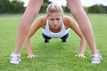 Image showing Women, portrait and push ups on field for fitness with exercise, training and workout on grass for sport. Athlete, person and confidence on ground with physical activity for healthy body and wellness