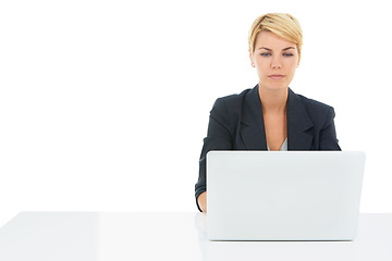 Image showing Business woman, laptop and desk in studio for online research, planning and website for human resources. Professional worker reading on a computer, typing and job search or FAQ on a white background
