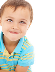 Image showing Smile, cute and portrait of child in a studio with sweet, positive and good attitude for development. Happy, childhood and face of young boy kid with casual style isolated by white background.