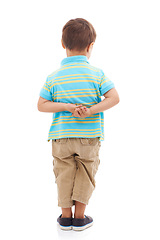 Image showing Child, boy and back in studio or white background for nervous student, kindergarten or mockup. Male person, kid and hands for anxiety or growing shy or innocent worry for mistake, problem or fear