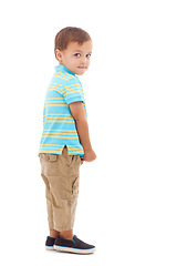 Image showing Child, portrait and guilty of mistake in studio or white background, mockup or development. Male person, model and sneaky face kindergarten or nervous student as naughty problem, uncertain or worried