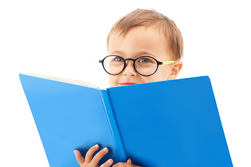 Image showing Boy child, reading and book in studio, learning and development with thinking by white background. Kid, student or language in kindergarten with education, knowledge and story in glasses with ideas