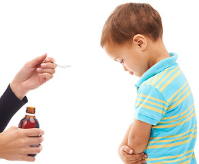 Image showing Hands, medicine and spoon for child in studio, sad and thinking with arms crossed by white background. Kid, mother and bottle for healthcare, pharmaceutical product and helping sick boy in profile